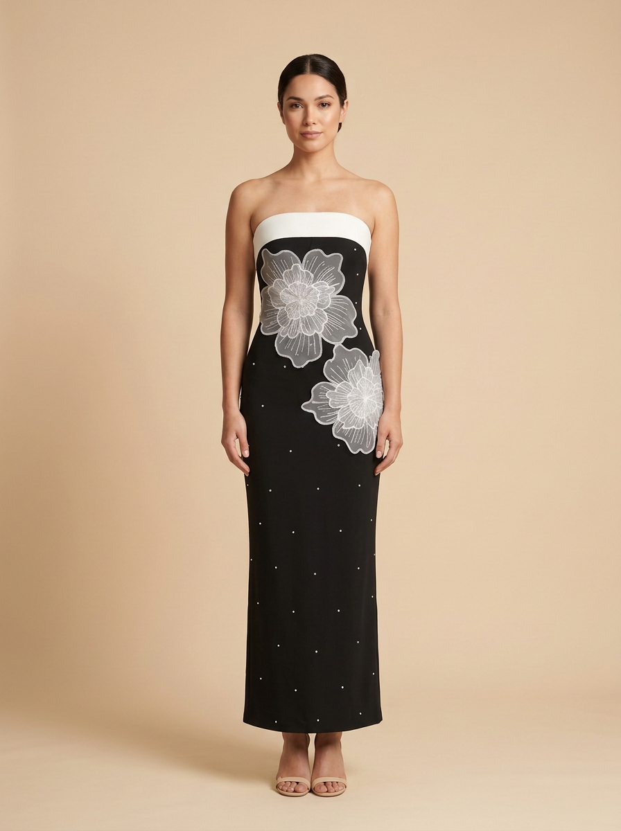 Dominó · Vestido midi negro sin tirantes con flor 3D blanca